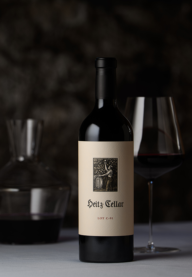 Legacy of Napa Valley: A bottle of 2019 Heitz Cellar Lot C-91 Cabernet Sauvignon on a table with a glass of wine and decanter.