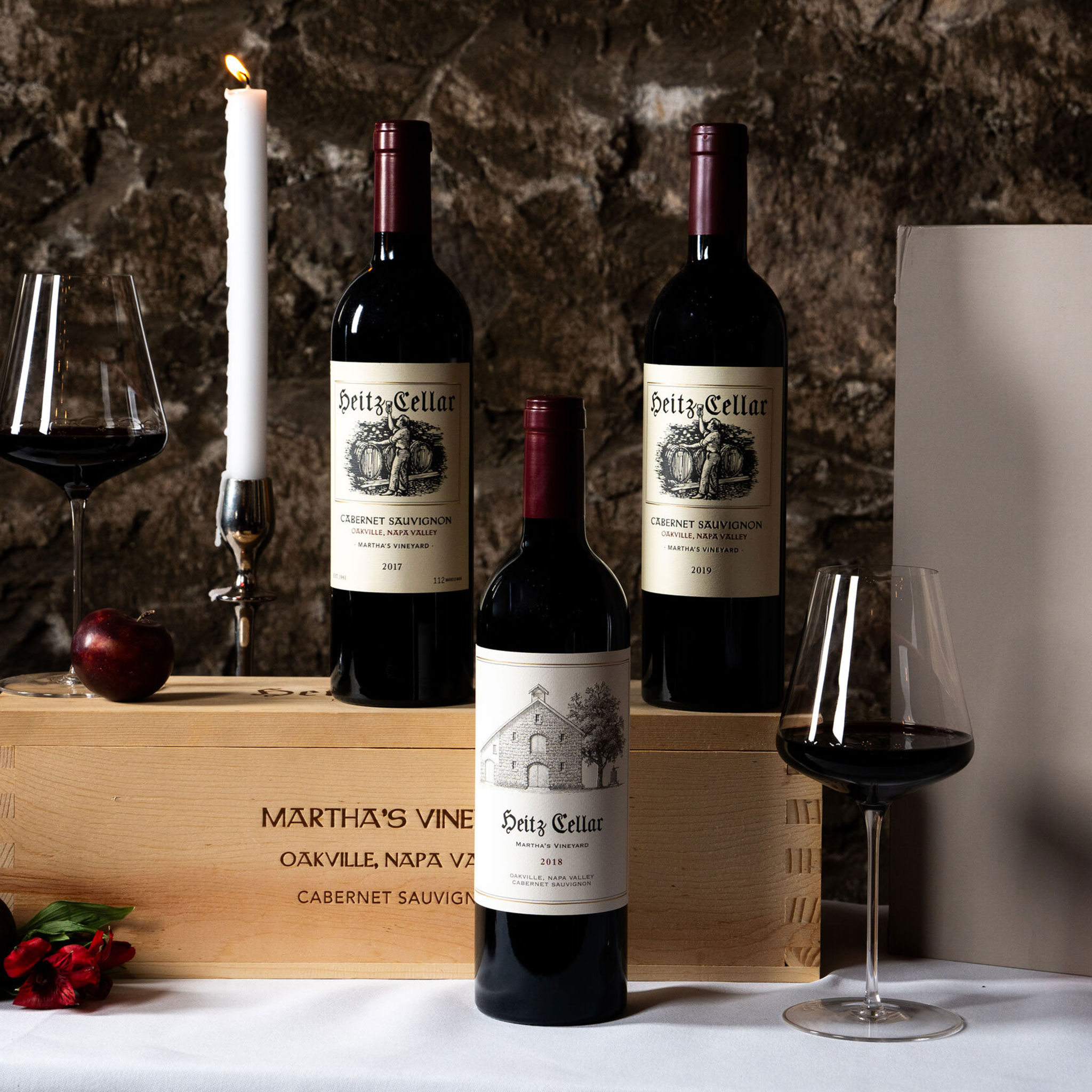 A Vertical of Martha's Vineyard: A bottle of 2017, 2018, and 2019 Martha's Vineyard Cabernet Sauvignon on a table next to a gift box.