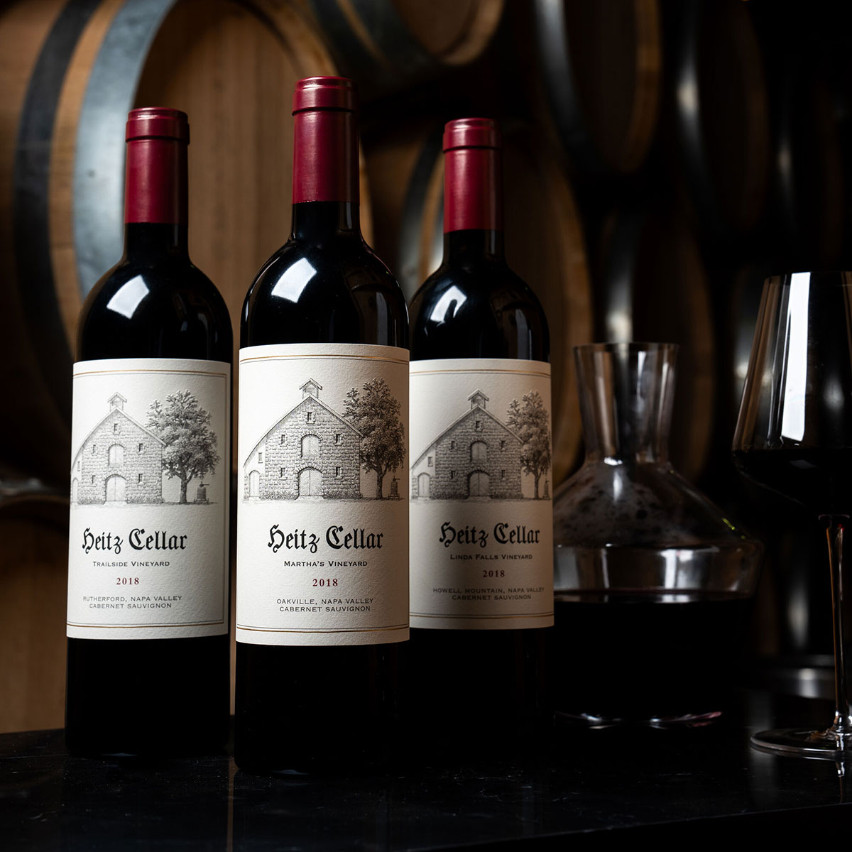 The 2018 Single-Vineyard Collection: a bottle of Heitz Cellar 2018 Linda Falls Cabernet Sauvignon, 2018 Martha's Vineyard Cabernet Sauvignon, 2018 Trailside Vineyard Cabernet Sauvignon on a table.