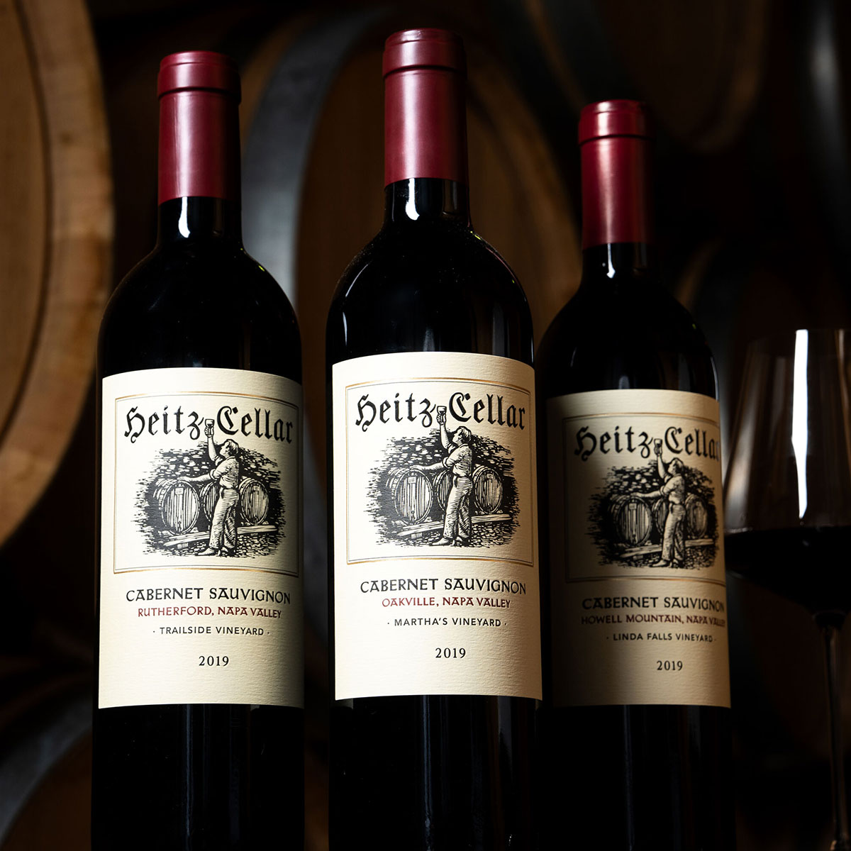 The 2019 Single-Vineyard Pre-Release Collection: a bottle of Heitz Cellar 2019 Linda Falls Cabernet Sauvignon, 2019 Martha's Vineyard Cabernet Sauvignon, 2019 Trailside Vineyard Cabernet Sauvignon on a table.