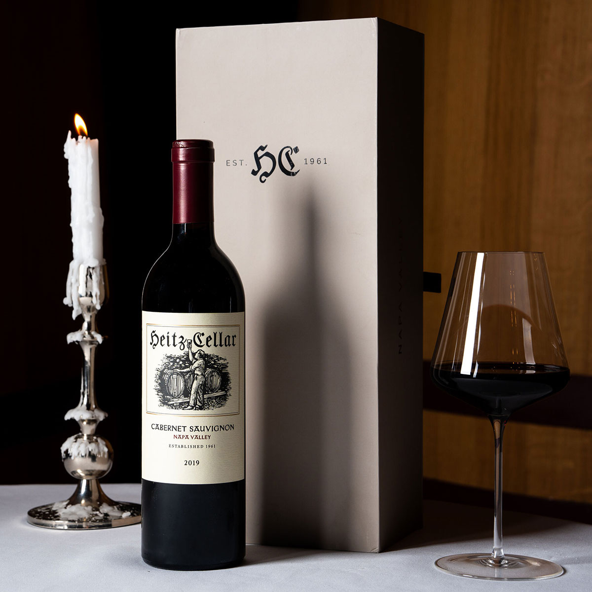 Bottle of Heitz Cellar 2019 Napa Valley Cabernet Sauvignon next to gift box.