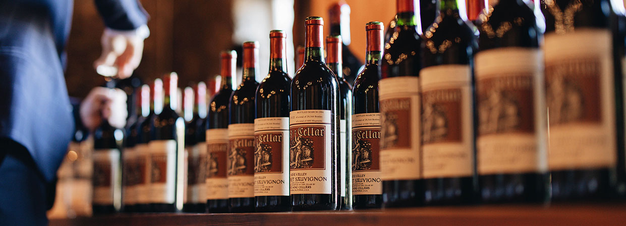 A collection of Heitz Cellar wines lined up on a table at a Heitz Society Member event.