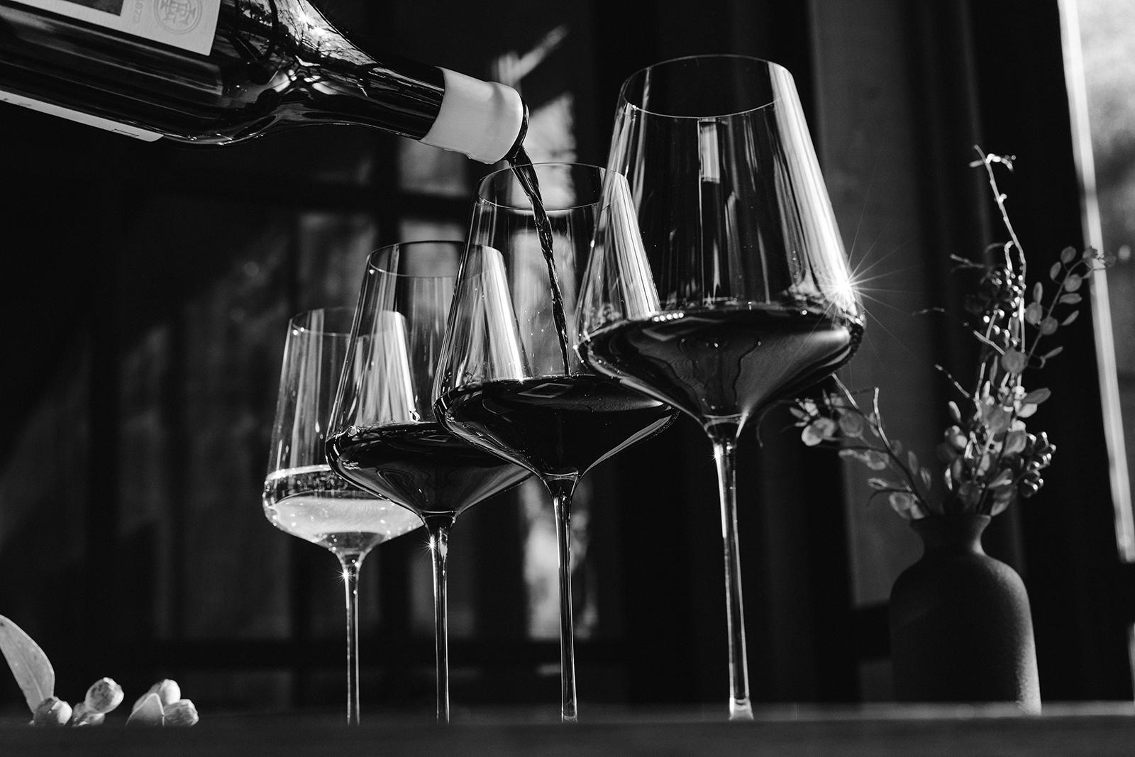 Ink Grade wine being poured into glasses.